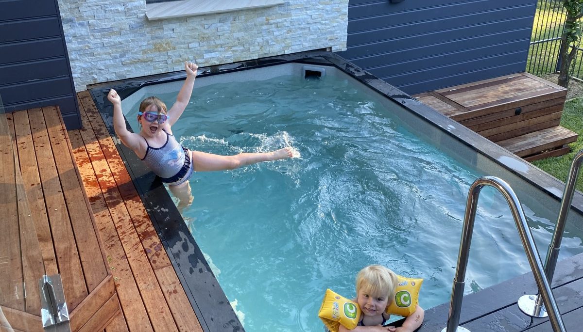 Freestanding fiberglass cocktail pool installed