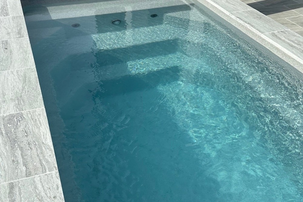 The Little Pool Co Fiberglass plunge pool installed Quartz pool color